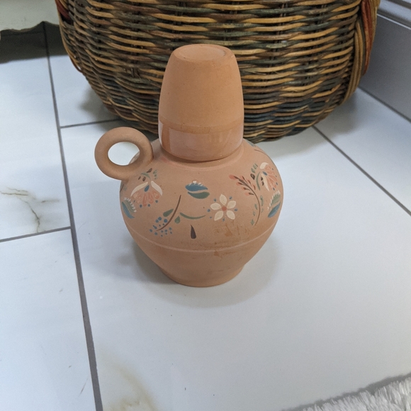 Terracotta bottle with cup